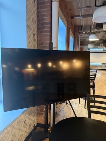 Large TV on rolling stand